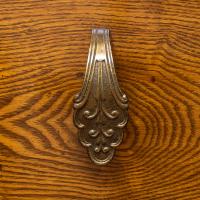 Curvey brass handle