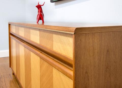 The way the teak timber veneer is used in this 1960's sideboard creates a striking result. It demonstrates that what can be created with timber veneers is only limited by the imagination of the craftsman.