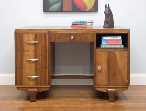 This 1940's desk - its design taken to another level with the use of a mix of solid walnut timber along with decorative walnut timber veneer.