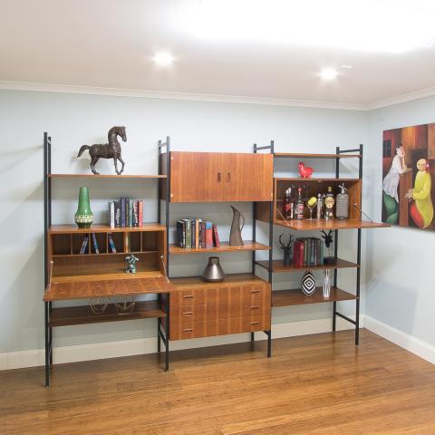Last but not least, a superbly designed Ladderax wall unit … not only is the teak timber veneer used to add interest to the front face, it adds a lovely depth to the drop-down servery tops.