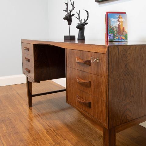 Striking use of solid timber and timber veneer Brazilian Rosewood in this 1960's Danish made desk.